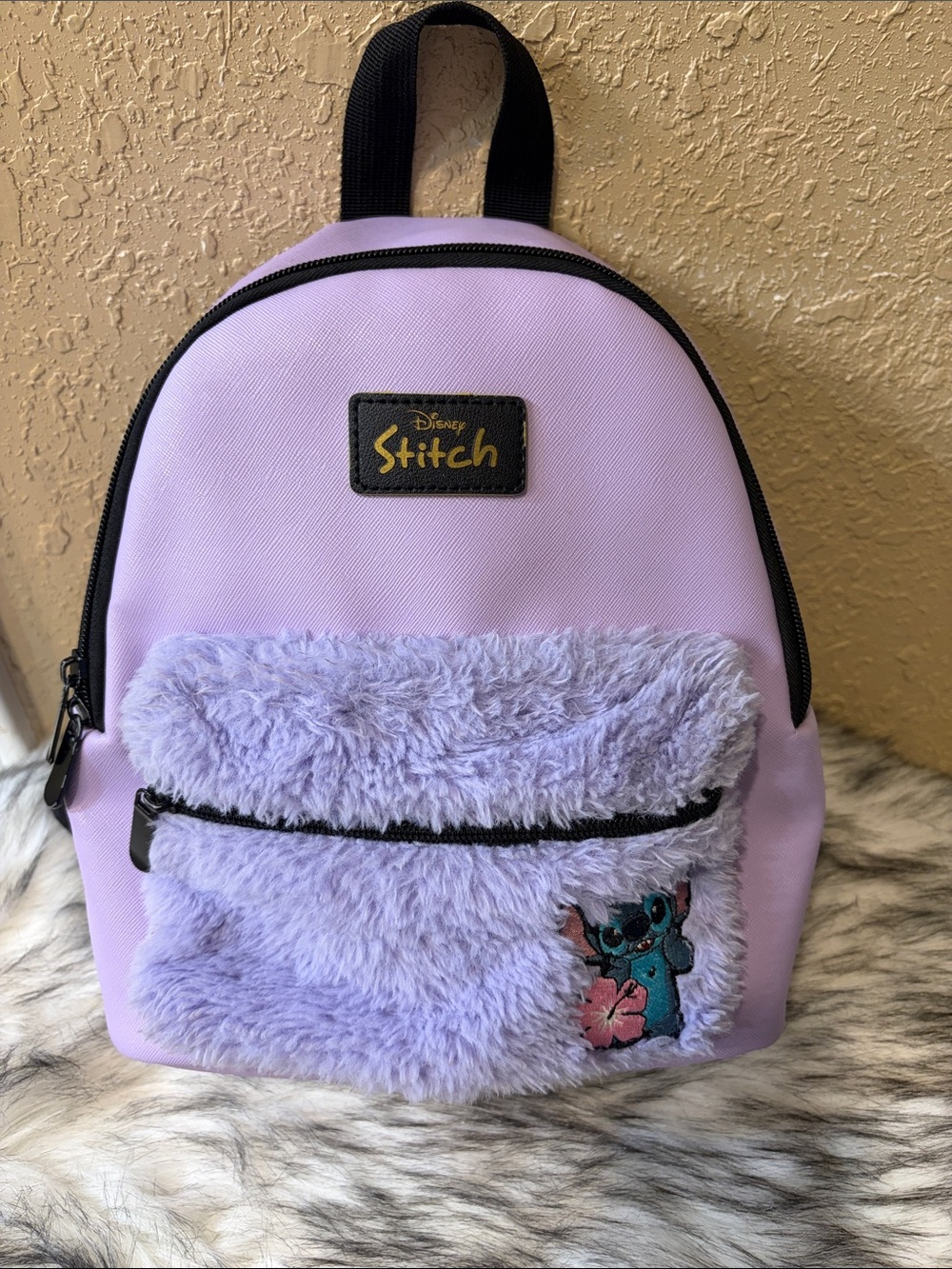 Disney Purple Stitch mini backpack with fuzzy front pocket and stitch patch